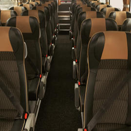 interior of Coast to Coast Travel coach, showing rows of coach seats